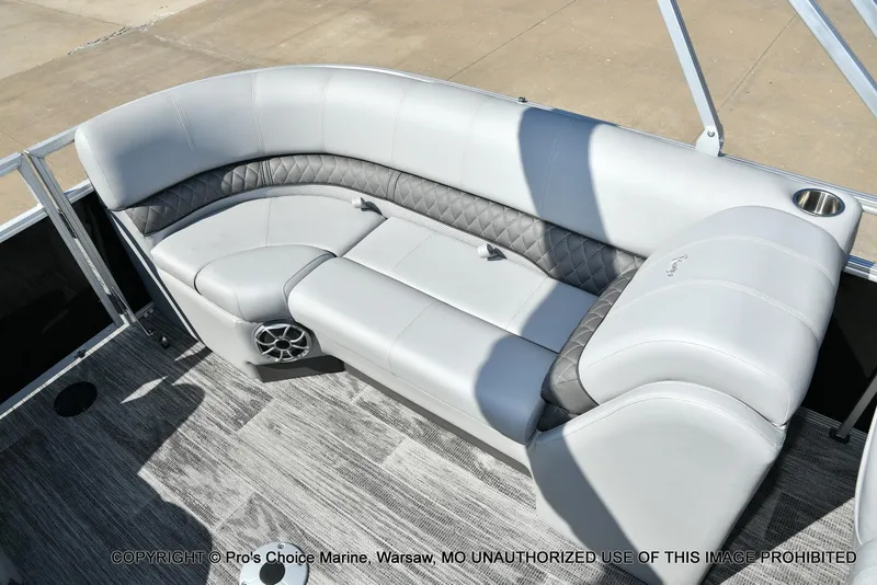 Slide: The Image of 2025 Ranger 243C Cruise boat interior with gray seating and modern design. - 37
