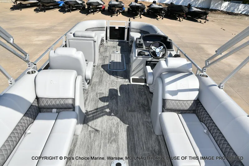 Slide: The Image of 2025 Ranger 243C Cruise pontoon boat interior with luxurious seating and modern helm. - 41