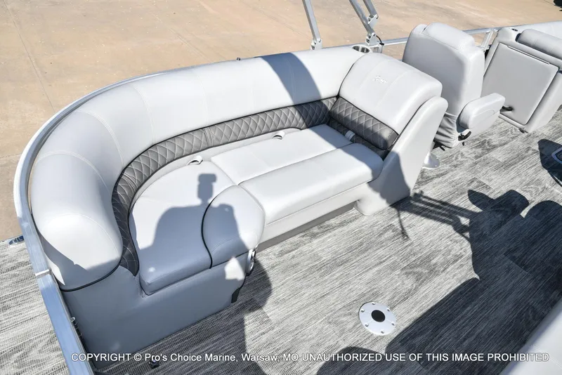 Slide: The Image of 2025 Ranger 243C Cruise boat interior with gray seating and modern design. - 43