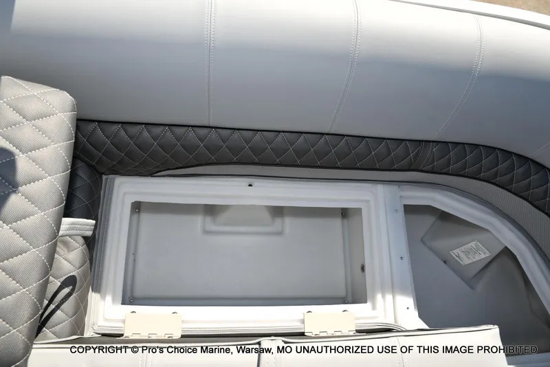 Slide: The Image of 2025 Ranger 243C Cruise boat interior storage compartment with quilted upholstery. - 45