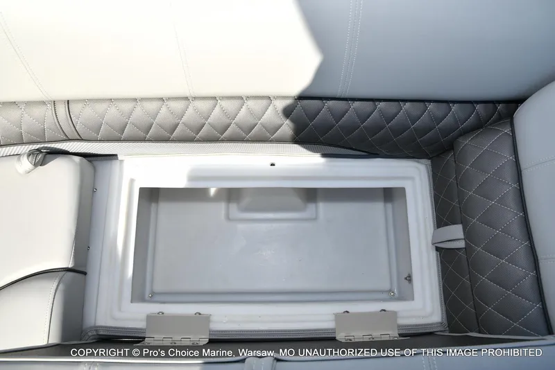Slide: The Image of 2025 Ranger 243C Cruise boat interior storage compartment with quilted gray seating. - 49
