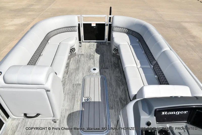 Slide: The Image of 2025 Ranger 243C Cruise boat interior with spacious seating and modern design. - 7