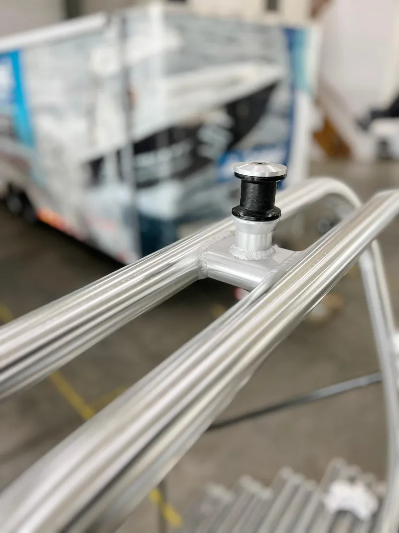 Slide: The Image of Close-up of 2023 Starcraft LX 22 R boat railing in a workshop setting. - 30