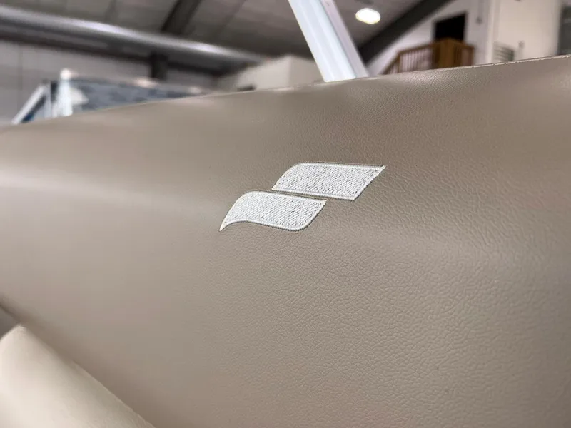Slide: The Image of Close-up of 2023 Starcraft LX 22 R boat seat with logo embroidery. - 33