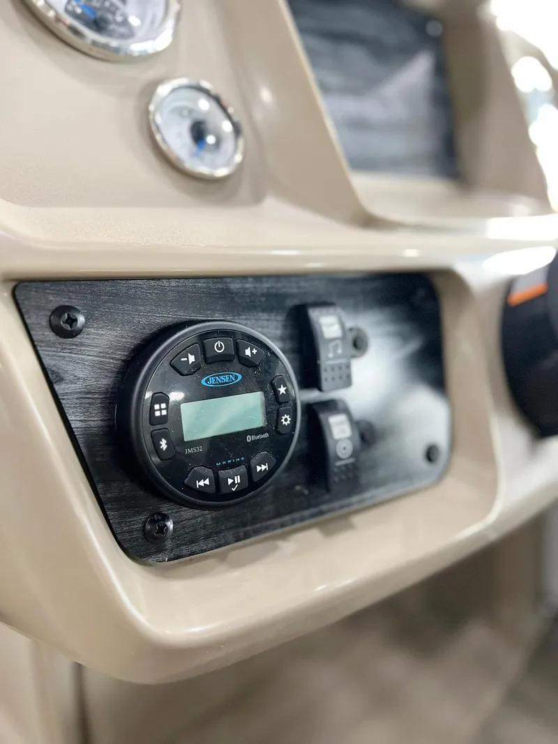 Slide: The Image of 2023 Starcraft LX 22 R dashboard with Jensen audio system and controls. - 6