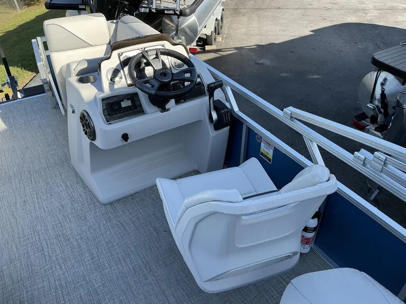 Slide: The Image of 2025 Tahoe Pontoon Boats Sport 17 REAR FISH helm with steering wheel and seating. - 6