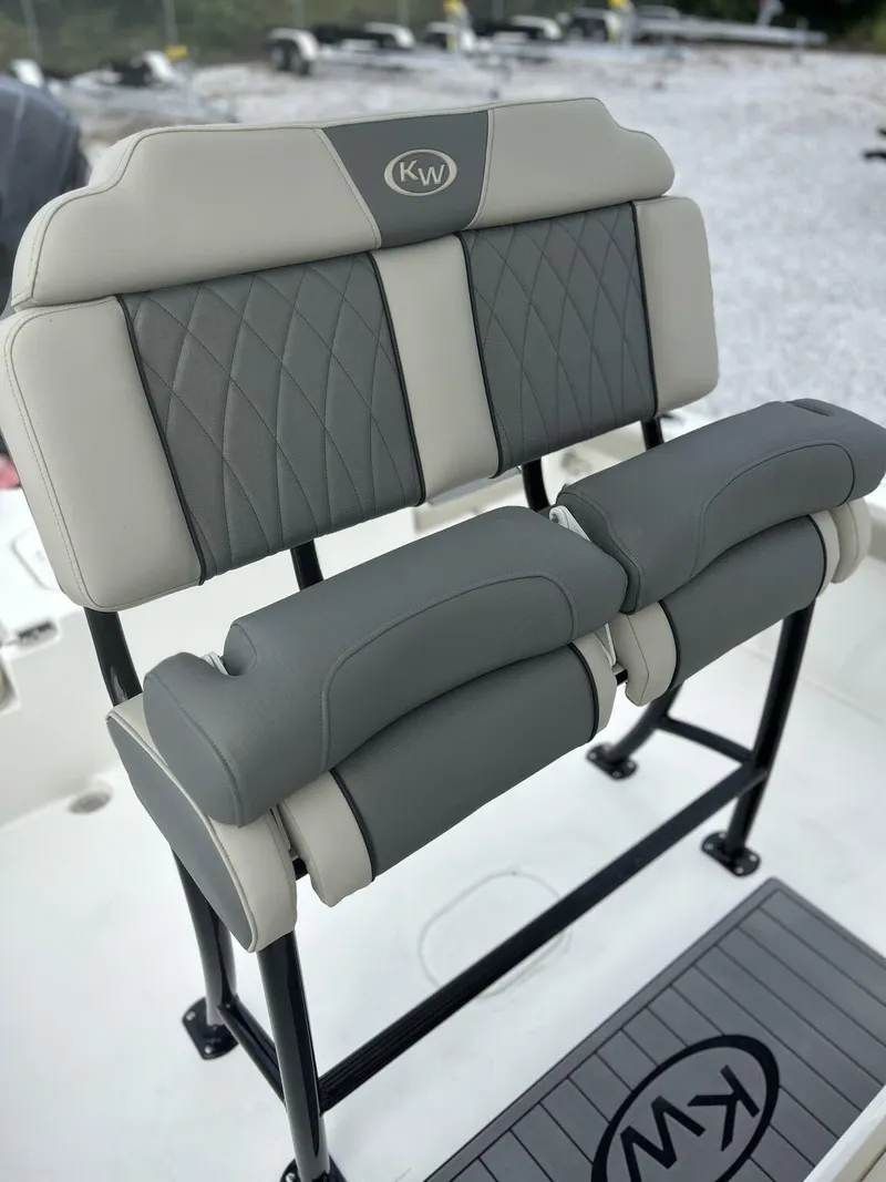 Slide: The Image of Key West 230BR 2025 boat seating with gray and beige upholstery. - 11