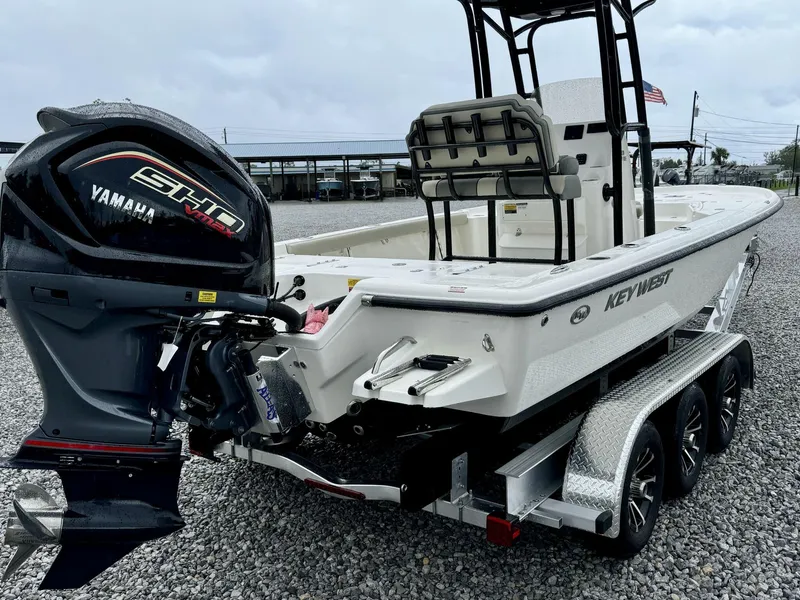Slide: The Image of 2025 Key West 230BR boat with Yamaha VMAX engine on a trailer. - 5