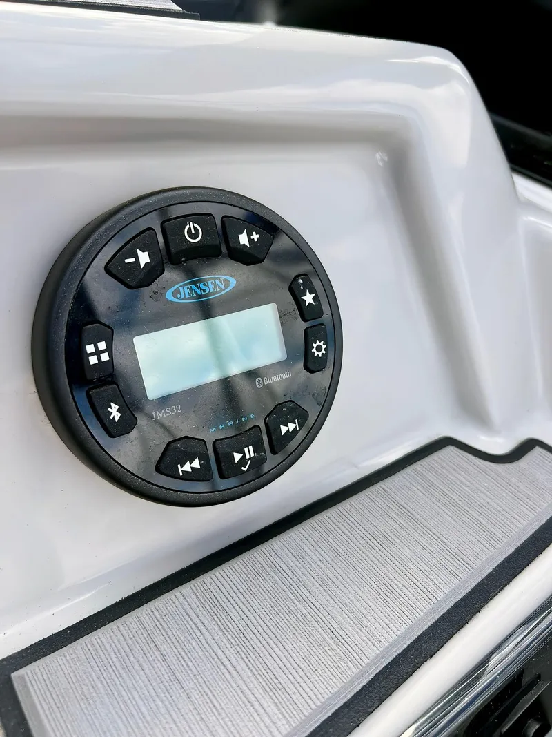 Slide: The Image of Jensen audio system on 2023 Starcraft SVX 190 OB boat dashboard. - 11