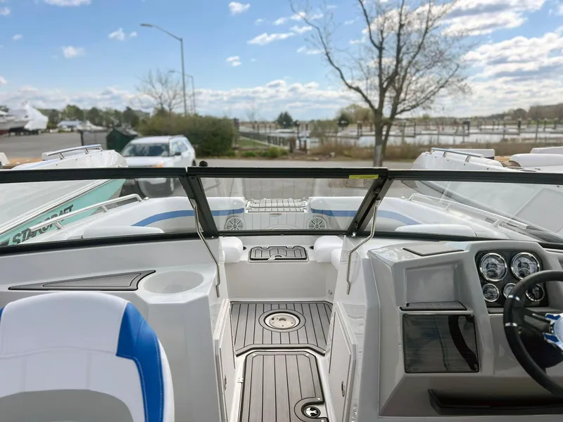 Slide: The Image of 2023 Starcraft SVX 190 OB boat interior with modern dashboard and seating. - 16