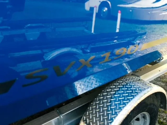 Slide: The Image of 2023 Starcraft SVX 190 OB boat on trailer, close-up view. - 18