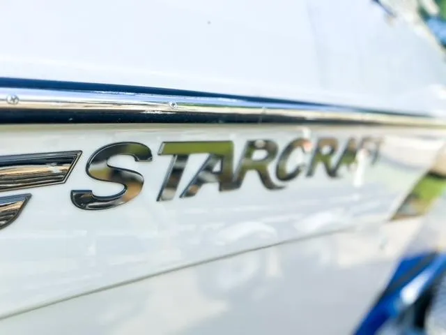 Slide: The Image of Close-up of 2023 Starcraft SVX 190 OB logo on boat exterior. - 19