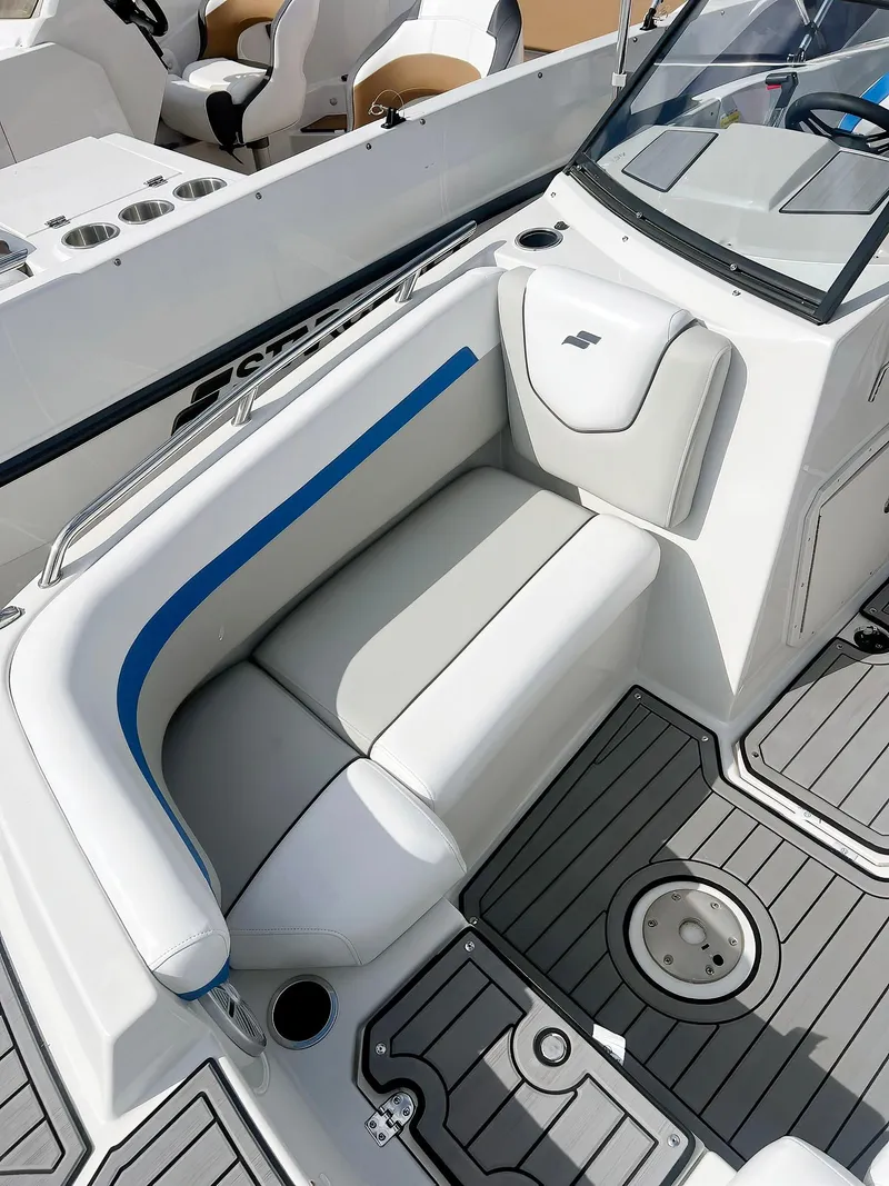 Slide: The Image of 2023 Starcraft SVX 190 OB boat interior with cushioned seating and modern design. - 7