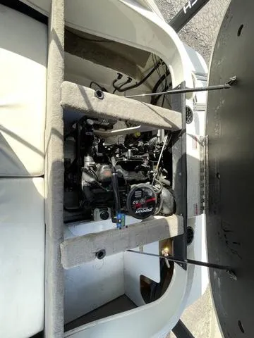 Slide: The Image of 2005 Sea Ray 180 Sport boat engine compartment with open hatch. - 11