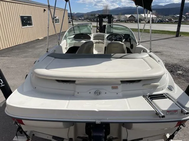 Slide: The Image of 2005 Sea Ray 180 Sport boat, rear view, parked outdoors. - 7
