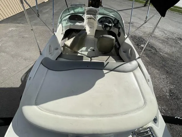 Slide: The Image of 2005 Sea Ray 180 Sport boat interior with seating and steering wheel. - 8