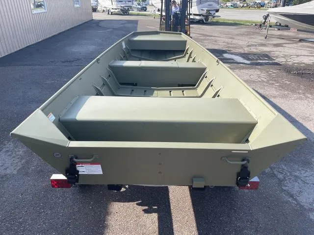 Slide: The Image of 2025 Lowe 1648M boat, olive green, parked on a trailer in a lot. - 2