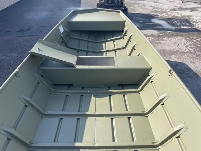 Slide: The Image of 2025 Lowe 1648M boat interior with open storage compartment, showing durable construction. - 4