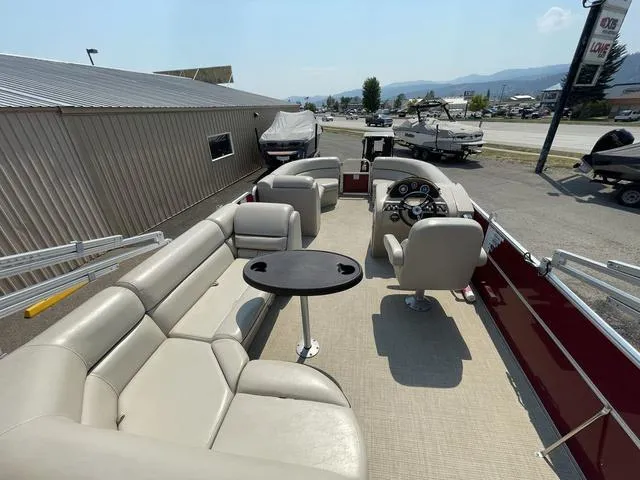 Slide: The Image of 2019 South Bay 222CR 2.75 pontoon boat with beige seating and steering console. - 5