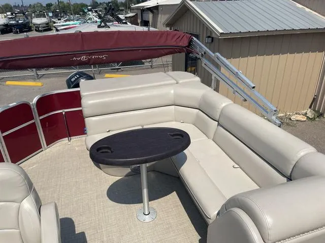 Slide: The Image of 2019 South Bay 222CR 2.75 pontoon boat with beige seating and table. - 6
