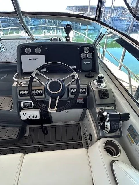 Slide: The Image of 2015 Formula 34 PC boat cockpit with steering wheel and control panel. - 11