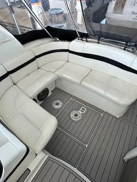 Slide: The Image of 2015 Formula 34 PC boat interior with white seating and gray flooring. - 12