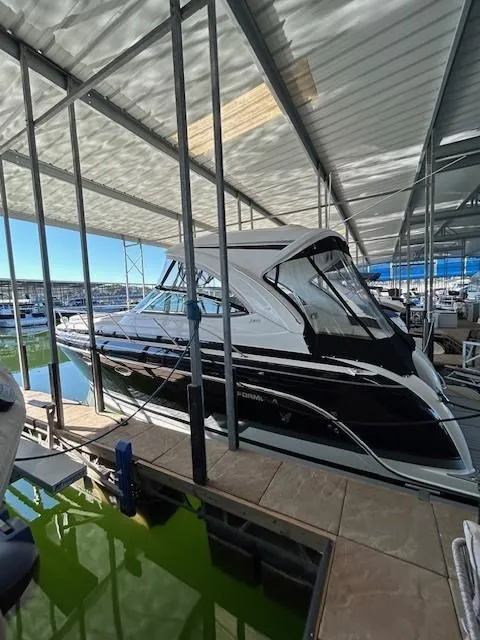 Slide: The Image of 2015 Formula 34 PC boat docked in a covered marina. - 2