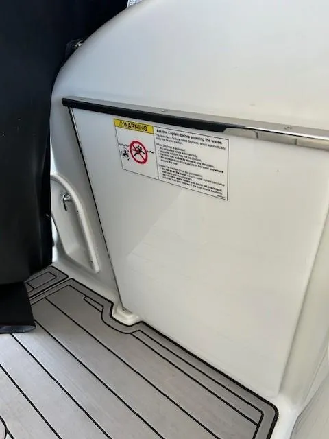 Slide: The Image of 2015 Formula 34 PC boat interior with warning label on white panel. - 20