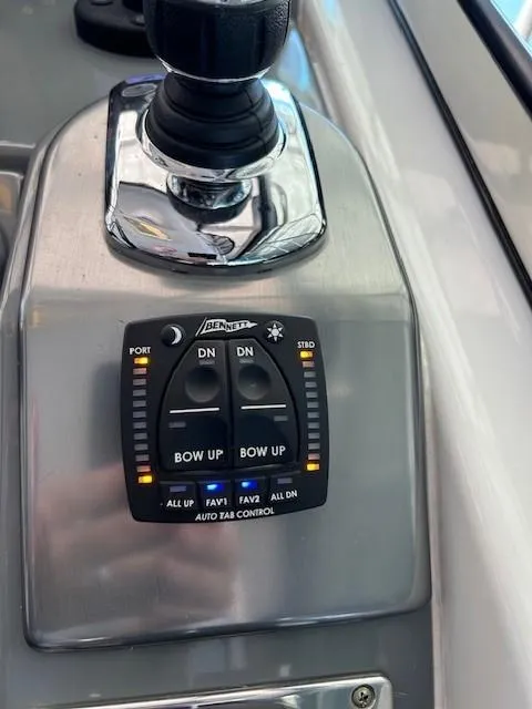 Slide: The Image of Bennett auto tab control panel on 2015 Formula 34 PC boat. - 21