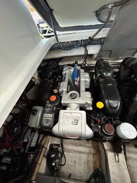 Slide: The Image of Engine compartment of a 2015 Formula 34 PC boat, featuring a powerful V8 engine. - 26