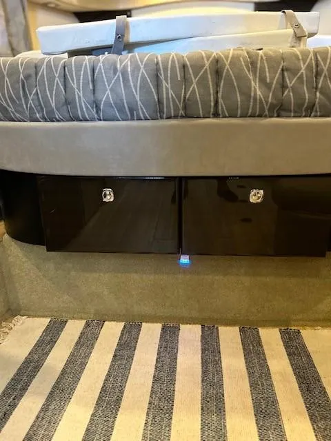 Slide: The Image of 2015 Formula 34 PC interior with striped carpet and storage compartments. - 28