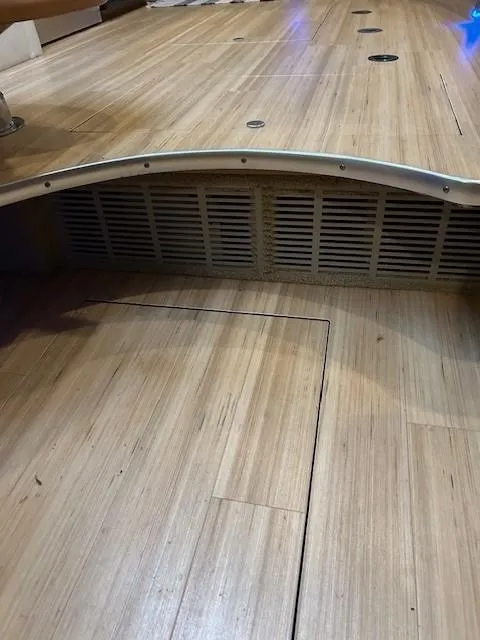 Slide: The Image of 2015 Formula 34 PC boat interior with wooden flooring and vented panel. - 29