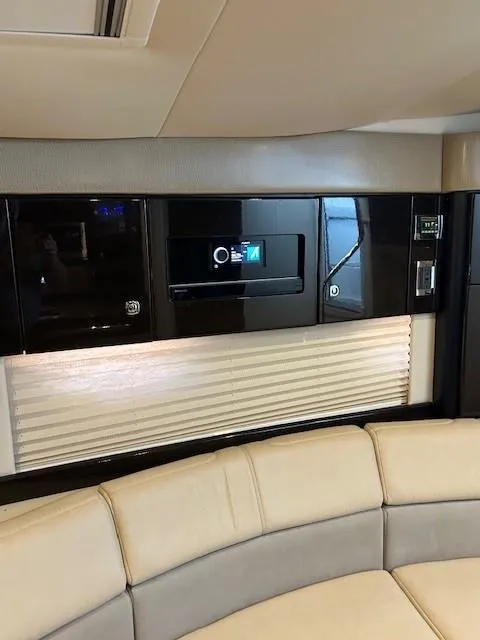 Slide: The Image of Interior of 2015 Formula 34 PC yacht with modern black cabinetry and beige seating. - 35