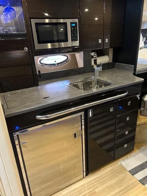 Slide: The Image of 2015 Formula 34 PC yacht kitchen with modern appliances and sleek cabinetry. - 39