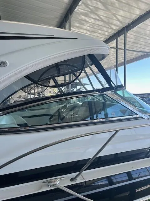 Slide: The Image of 2015 Formula 34 PC yacht under covered dock, side view. - 4