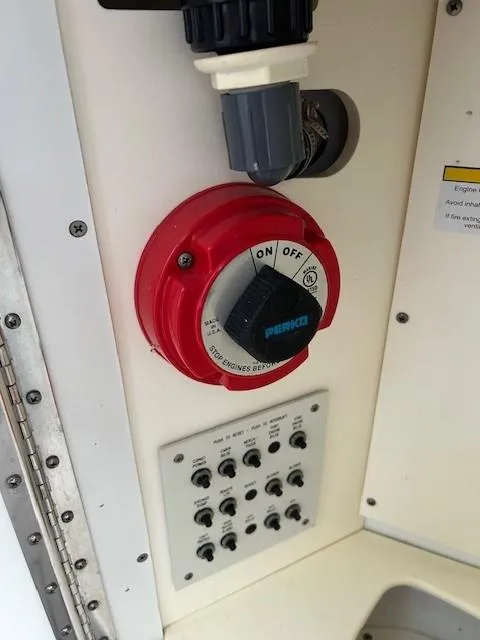 Slide: The Image of Control panel with red Perko switch on a 2015 Formula 34 PC boat. - 40