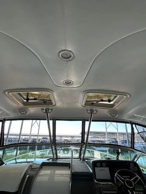 Slide: The Image of 2015 Formula 34 PC yacht interior with sunroof and modern dashboard. - 49