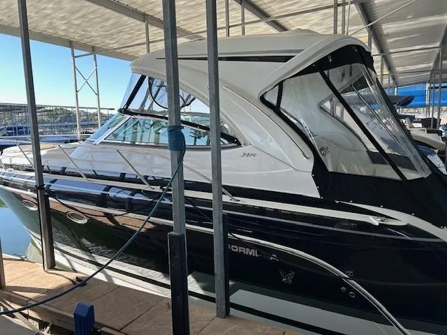 Slide: The Image of 2015 Formula 34 PC yacht docked under a covered marina. - 8