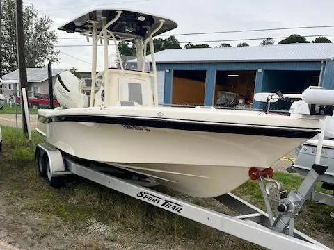 Slide: The Image of 2021 BlackJack 256 Coastal Bay boat on Sport Trail trailer, parked outdoors. - 1