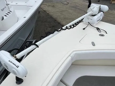 Slide: The Image of 2021 BlackJack 256 Coastal Bay boat with Minn Kota trolling motor on deck. - 9