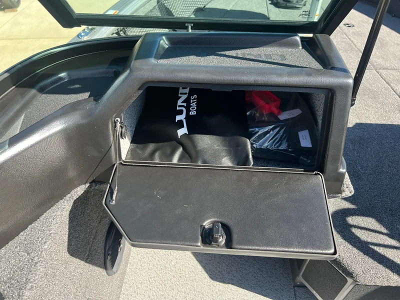 Slide: The Image of 2025 Lund 2075 IMPACT XS boat storage compartment with accessories. - 19