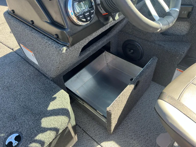 Slide: The Image of 2025 Lund 2075 IMPACT XS boat interior with open storage compartment. - 20