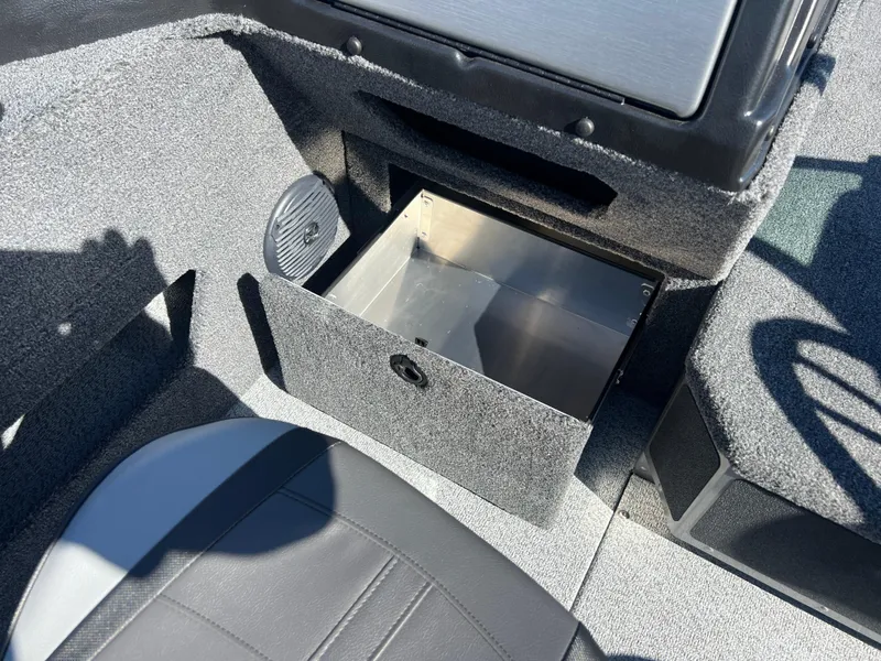 Slide: The Image of 2025 Lund 2075 IMPACT XS boat interior with open storage compartment. - 21