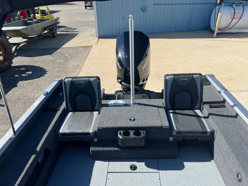 Slide: The Image of 2025 Lund 2075 IMPACT XS boat interior with seating and motor. - 22