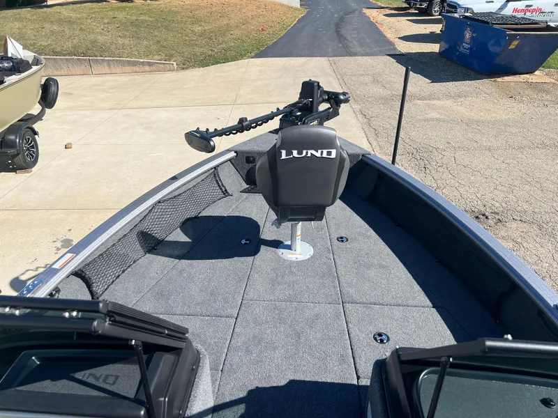 Slide: The Image of 2025 Lund 2075 IMPACT XS boat with trolling motor on a sunny day. - 3