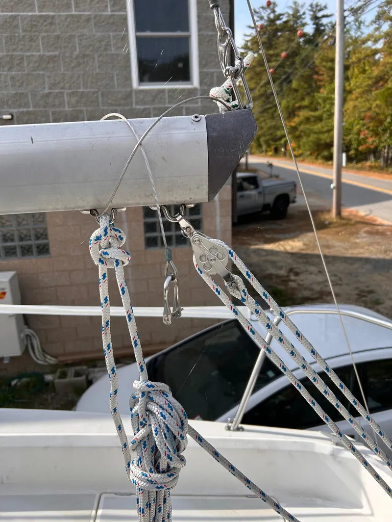 Slide: The Image of Sailboat rigging on a 1986 CAL 22, featuring ropes and hardware. - 15