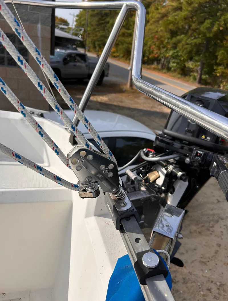 Slide: The Image of Close-up of 1986 CAL 22 sailboat rigging and motor in a marina setting. - 16