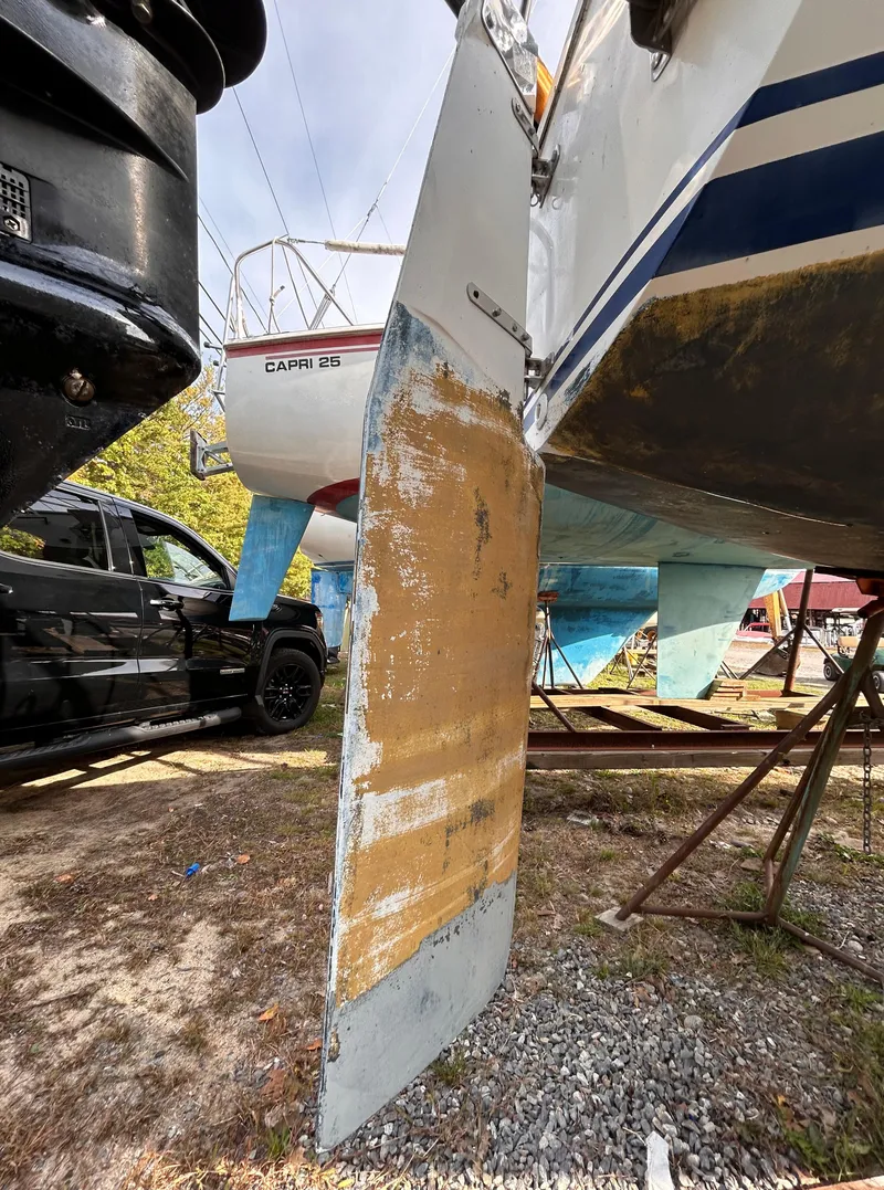 Slide: The Image of 1986 CAL 22 sailboat keel repair in a boatyard. - 19
