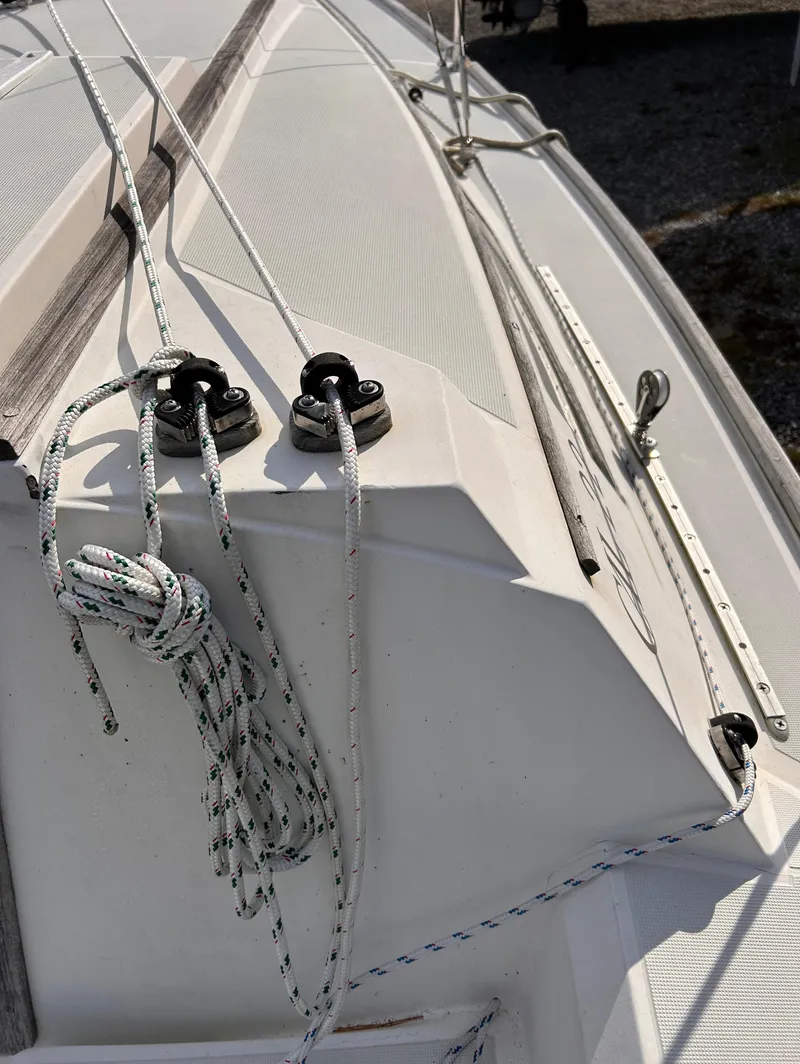 Slide: The Image of Close-up of 1986 CAL 22 sailboat deck with ropes and fittings. - 7