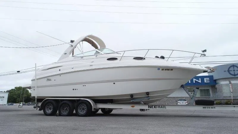 Slide: The Image of 2004 Chaparral 260 Signature boat on trailer in parking lot. - 10